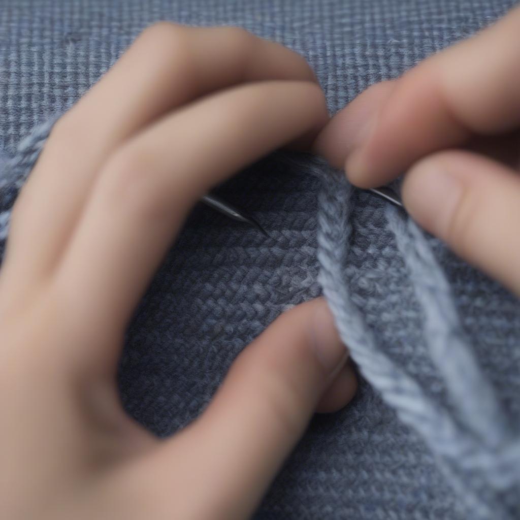 Securing the brim of a woven hat with stitching.