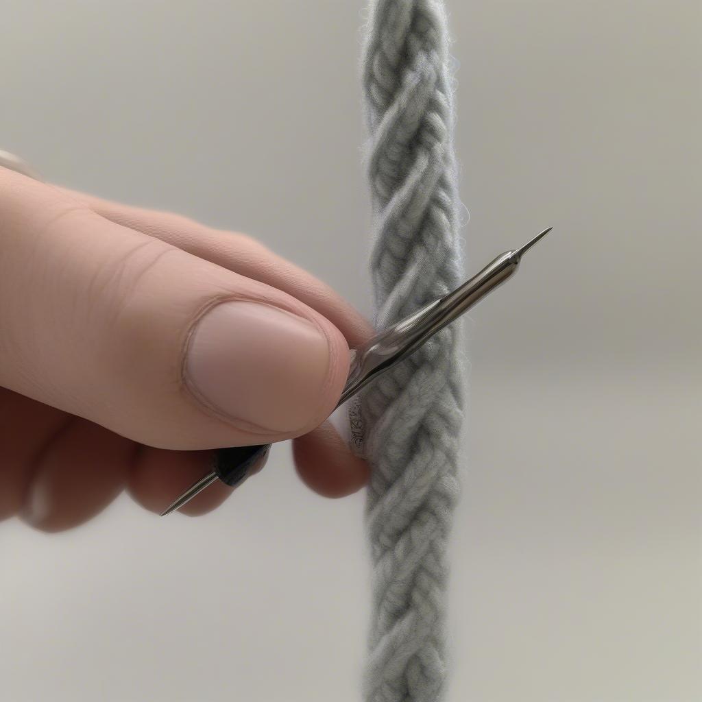 Close-up of a left-handed crocheter performing front post and back post double crochet stitches, highlighting the difference in hook placement around the post.