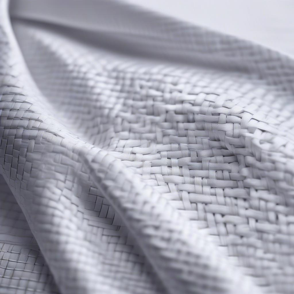 A close-up of a men's white collar basket weave dress shirt, showcasing the intricate texture of the fabric.