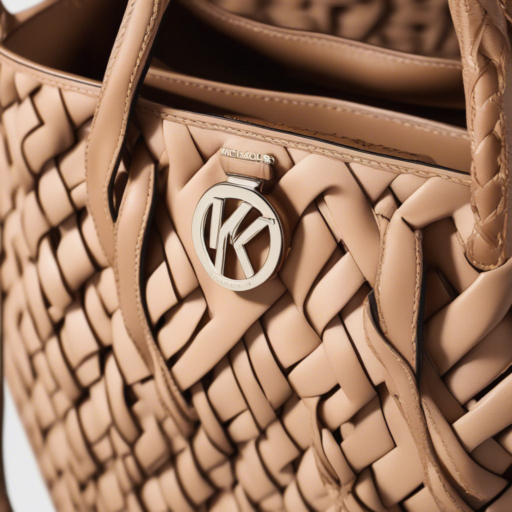 Close-up of the Michael Kors Ivy Medium Woven Tote Bag showing its intricate weave and leather details