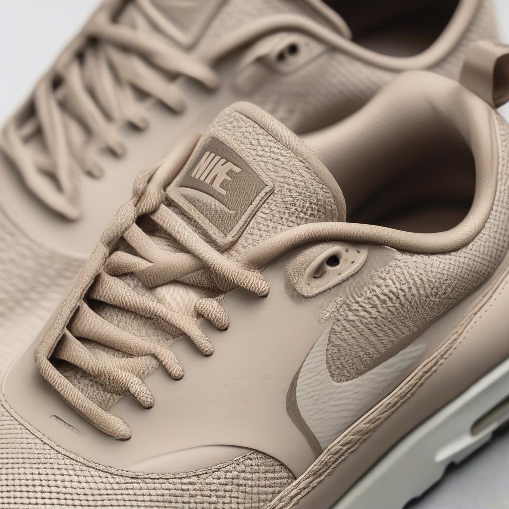 Close-up view of the Nike Air Max Thea Basket Weave in Oatmeal showcasing the intricate woven texture