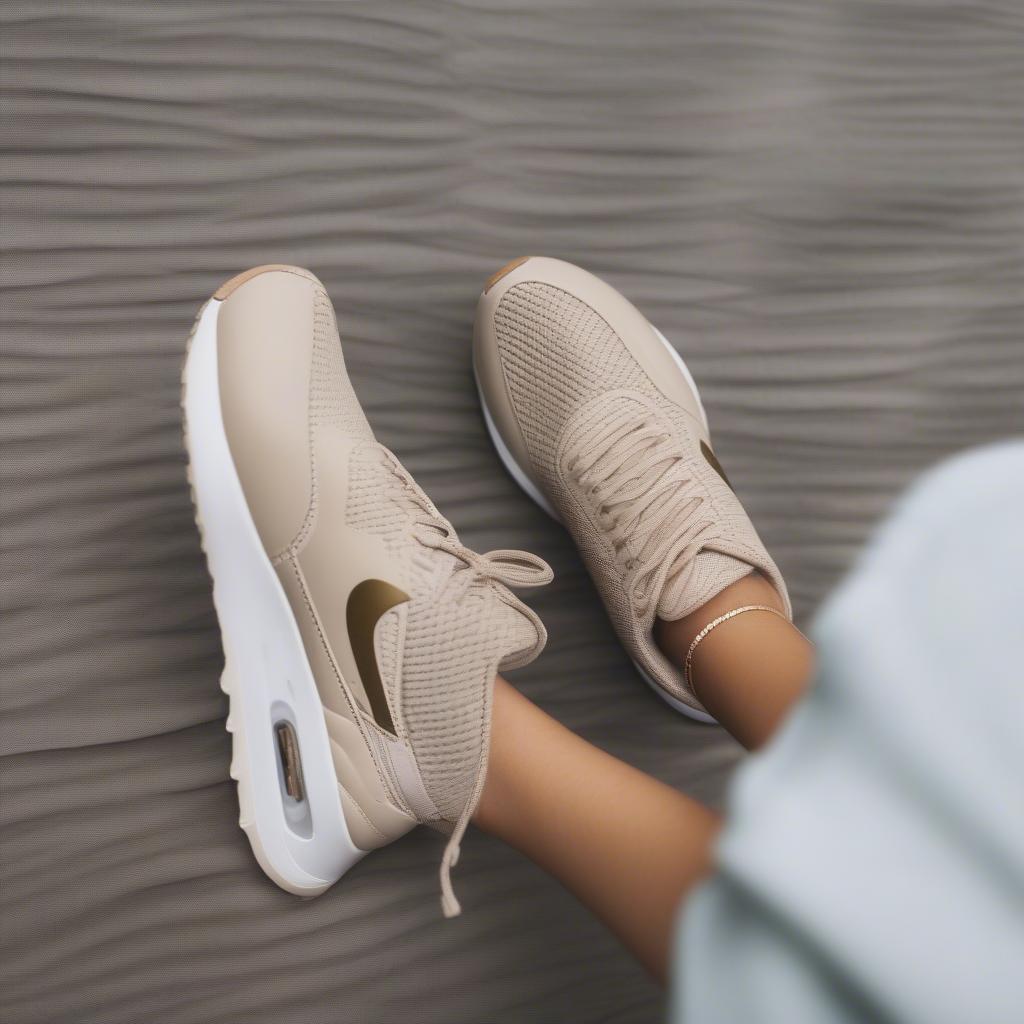 Nike Air Max Thea Basket Weave sneakers in oatmeal worn on feet