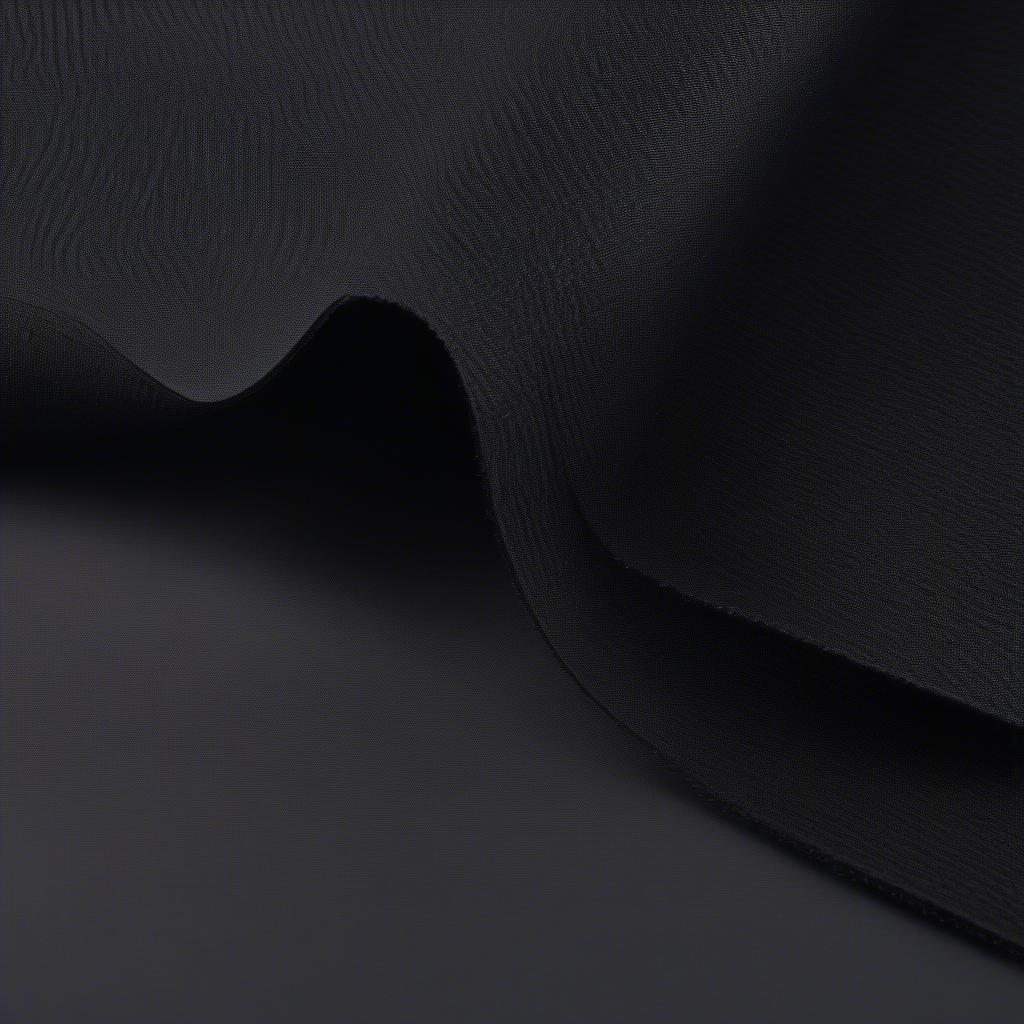 Close-up view of black non-woven fabric