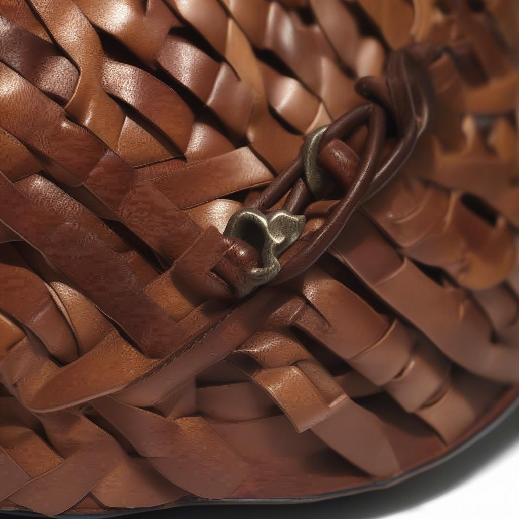 Detailed view of the woven leather pattern on the Patricia Nash Discovery Saddle Bag, emphasizing the craftsmanship and intricate design.