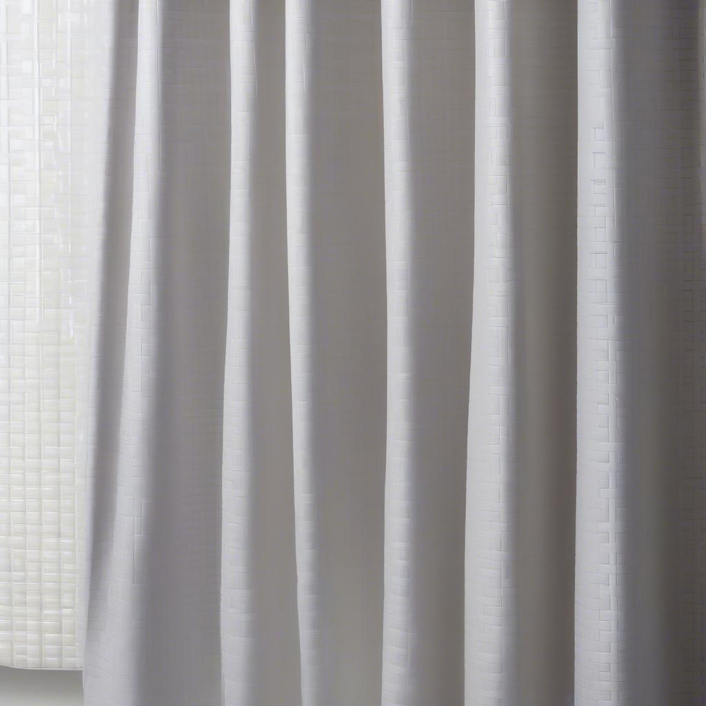 A PEVA shower curtain with a detailed basket weave texture.