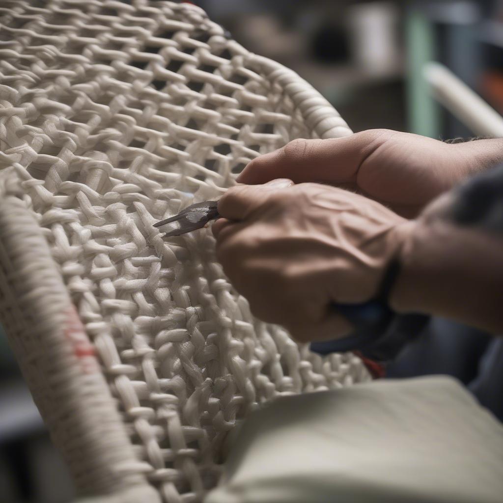 A Professional Repairing a Complex Break in a Plastic Weave Chair 