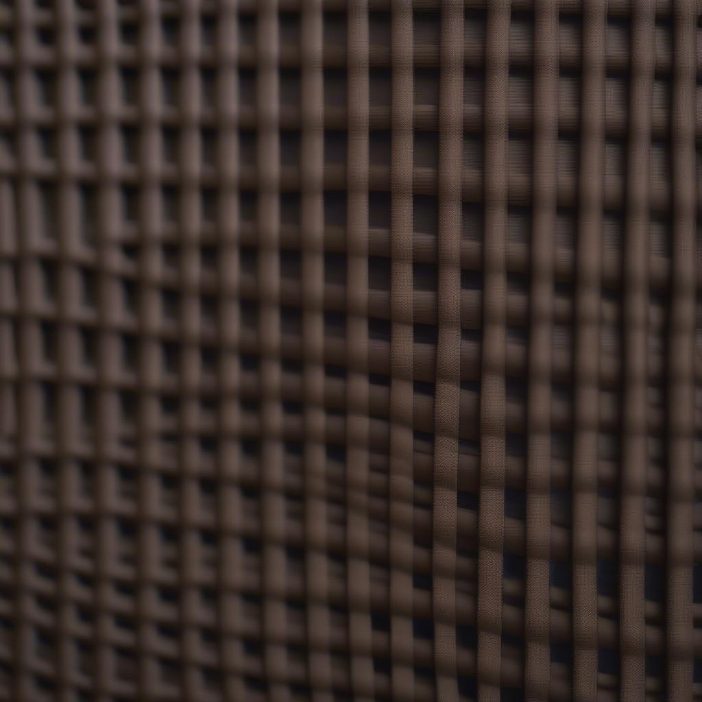 Close-up view of a rubber weave lawn chair showcasing the intricate weave pattern and durable material.