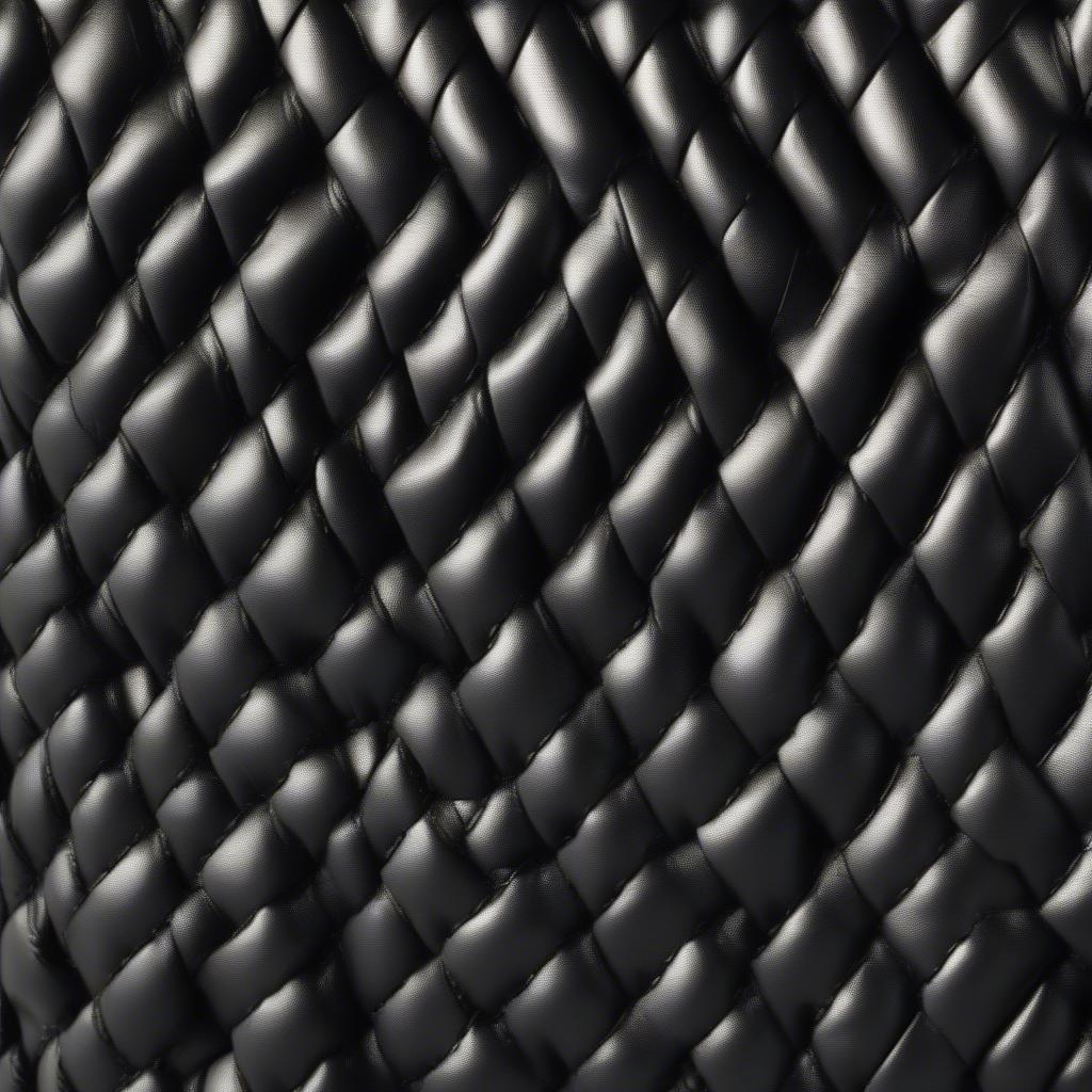 Close-up of the Seychelles Black Alice woven basket weave pattern