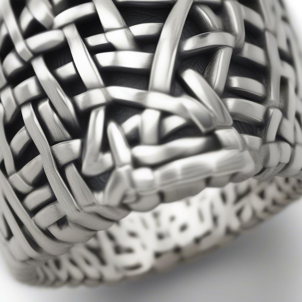 Close-up of a sterling silver basket weave ring showcasing the intricate details of the woven pattern