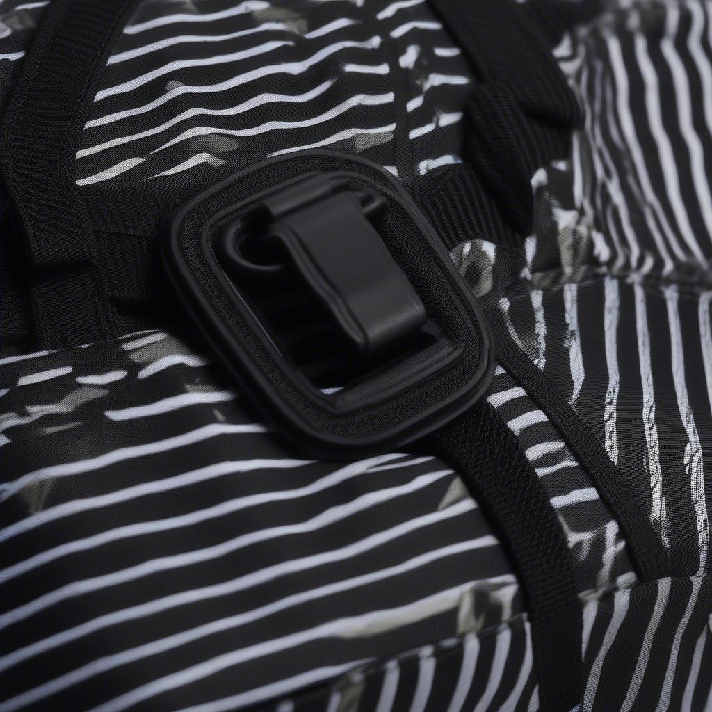 Close-up view of the Supreme Woven Stripe Waist Bag in Black