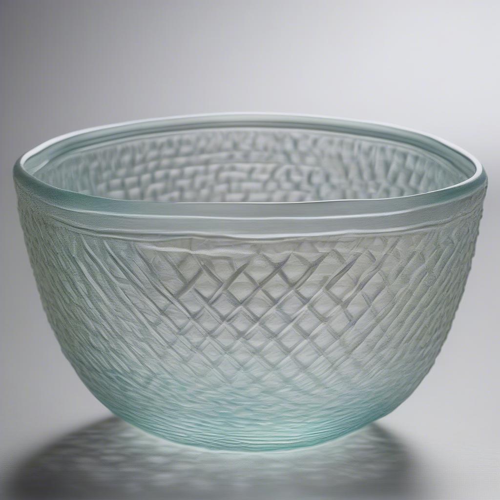 Close-up of a Tiffany Basket Weave Bowl, showcasing the intricate details and craftsmanship of the woven glass design.