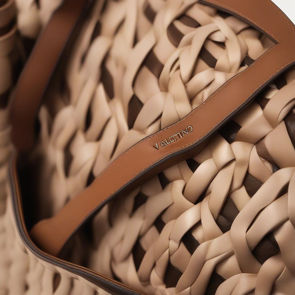 Close-up of a Valentino woven tote bag showcasing the intricate weave and luxurious leather details.