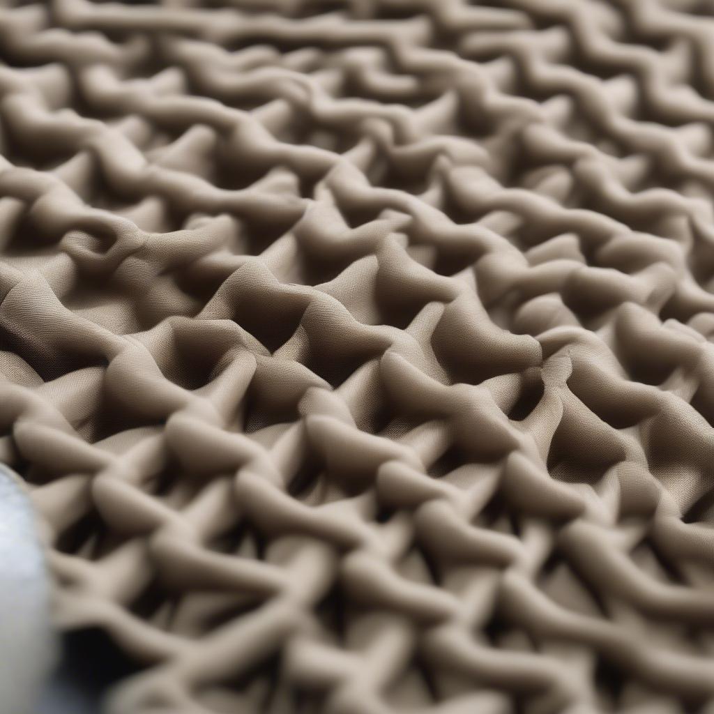 Close-up view of the waffle weave pattern on a bungee chair, showcasing its intricate design and texture.