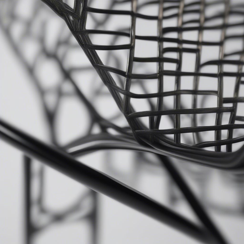 Close-up view of a weave tubular chair showing the intricate details of the woven pattern