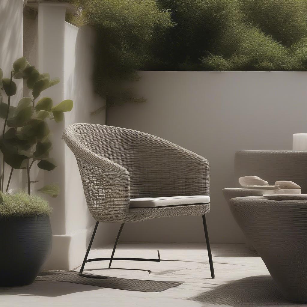 A weave tubular chair placed in a beautiful outdoor setting