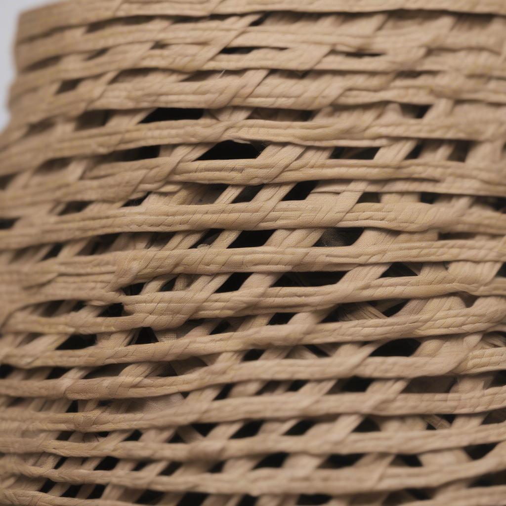 Close-up of a weaved bucket hat made from natural fibers like raffia or seagrass.