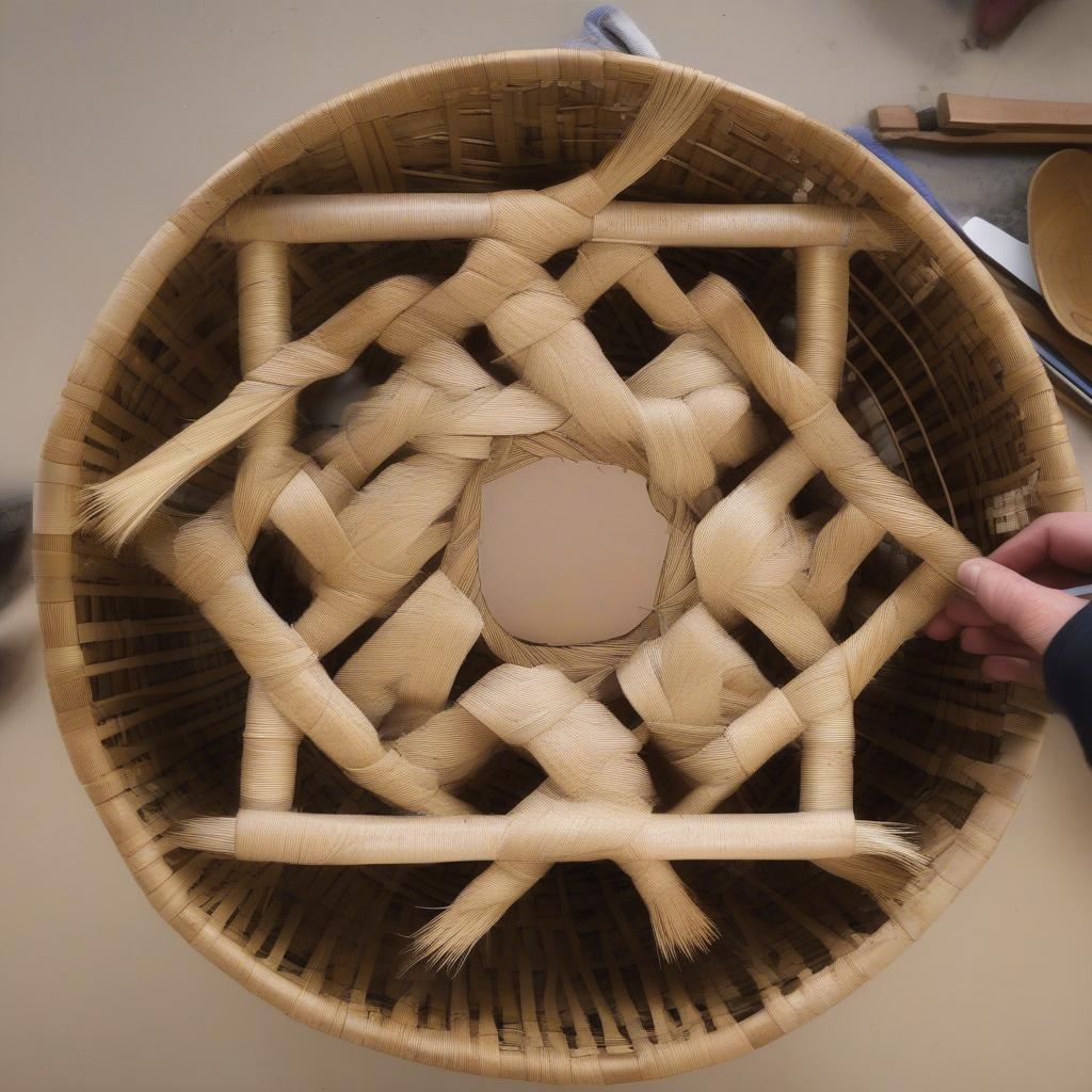 Creating the base of a round woven basket