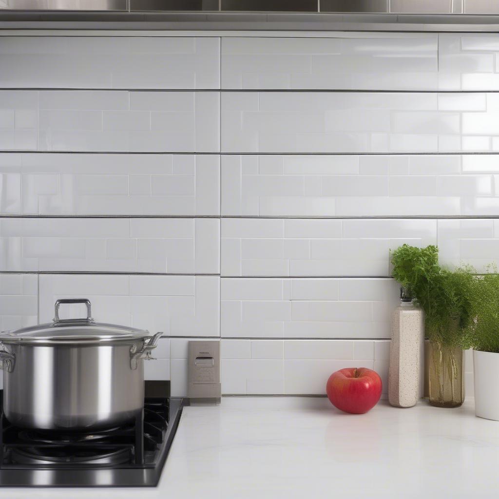 White subway tile basket weave backsplash in a modern kitchen.