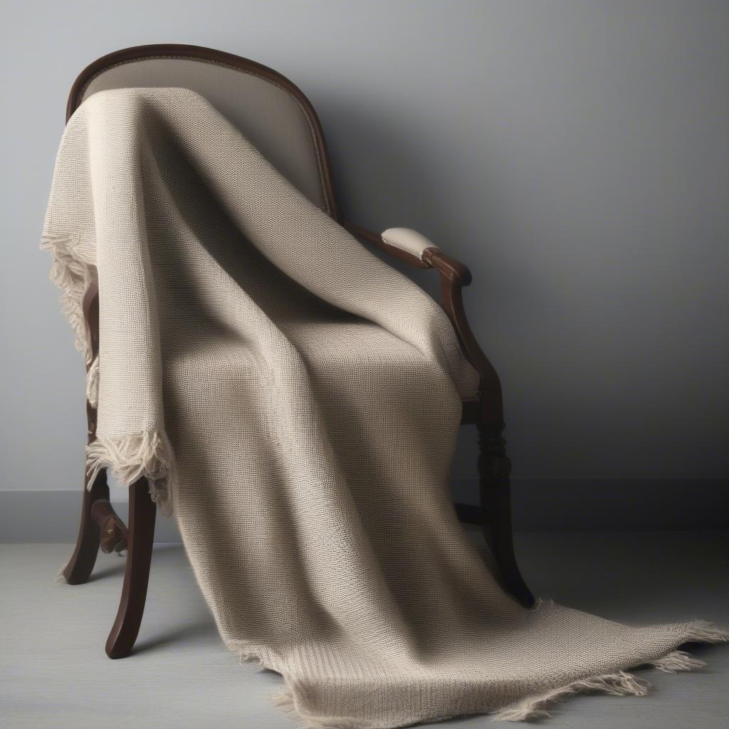 Wool basket weave fabric draped over a chair, showcasing its drape and texture